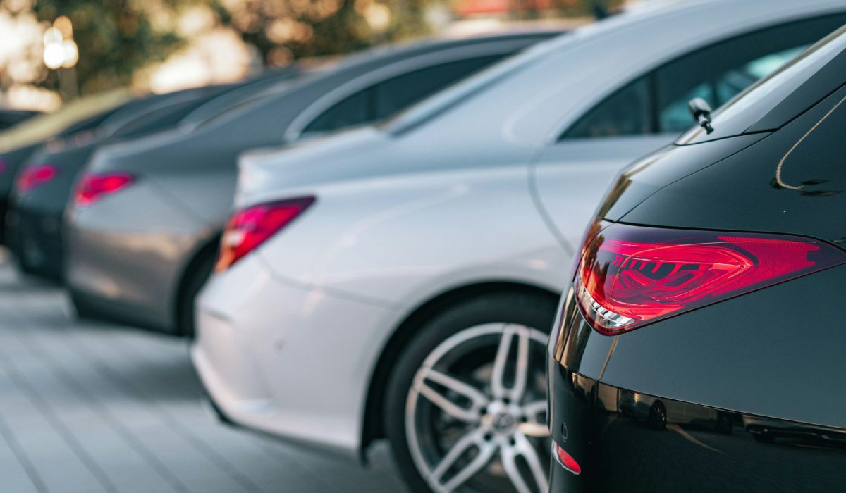 Selective focus view of different Mercedes-Benz cars parked in a row